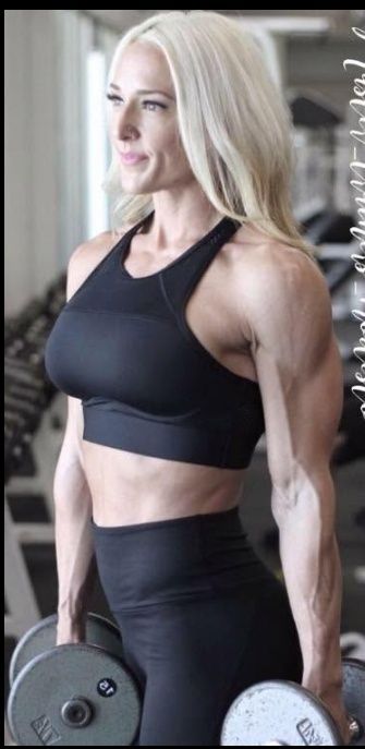 Jennifer Haines, NASM Certified Personal Trainer, holding dumbbells in a gym